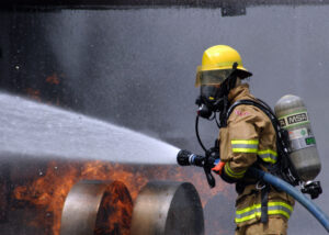 US_Navy_080730-N-5277R-003_A_Commander_Naval_Forces_Japan_firefighter_douses_a_fire_on_a_dummy_aircraft_during_the_annual_off-station_mishap_drill_at_Naval_Support_Facility_Kamiseya.jpg