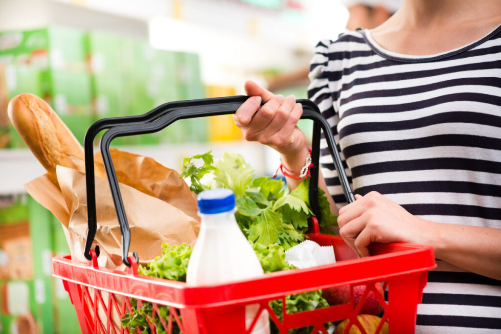 Woman,Shopping,At,Store,With,Shopping,Basket.